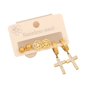 Three pairs of gold stainless steel earrings featuring floral, ball, and cross designs