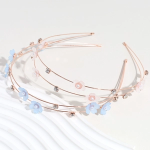 Three rose gold double-layer floral headbands with pink and blue rhinestone flowers