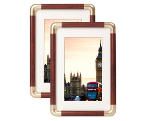 Classic mahogany wood texture photo frame with gold corner protectors and white mat