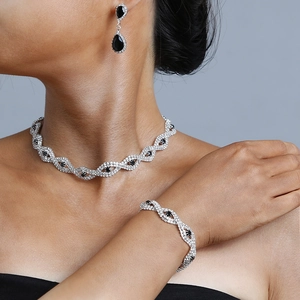 Elegant bridal necklace, bracelet and earrings set with black teardrop stones and crystals