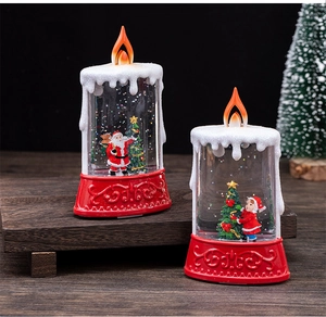 Close-up of LED water-filled candle lantern with spinning glitter and Santa scene
