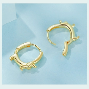 Detailed close-up of S925 sterling silver stamp on golden dachshund dog hoop earrings