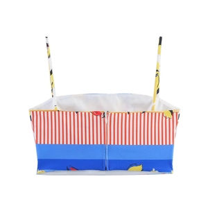 Women's summer crop top with lemon print, red stripes and blue patchwork on white background