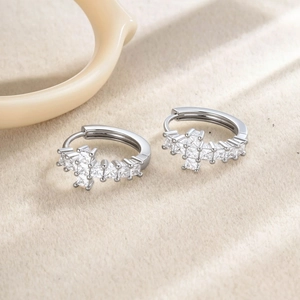 Silver geometric hoop earrings with clear square zircons in a cross pattern for unisex wear