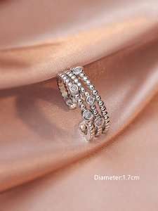 Macro shot of silver triple-layered beaded ring with zircons and 1.7cm diameter detail