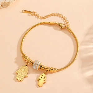 Bracelet Hamsa en acier inoxydable plaqué or 18 carats avec accents en cristal
