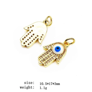 Macro detail of Hamsa Hand charms with zircons, sizing specs 10.5x17x3mm and 1.1g weight
