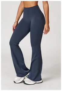 Detail view of high-waisted dark blue flare yoga pants with slim side seam design