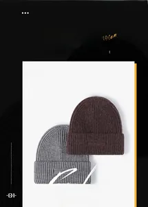Detail showing gray and dark brown thick ribbed knit beanies with wide folded cuffs