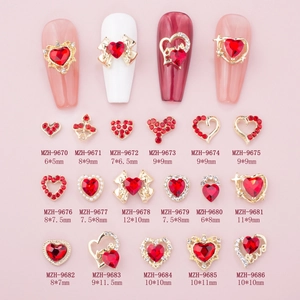 Red heart-shaped nail art charms in gold alloy with bows and rhinestones for DIY manicure