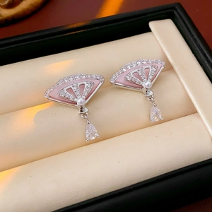 Detailed view of pink fan-shaped earrings with pearls and zircon waterdrop pendants