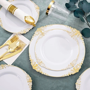 Elegant white plastic plate set with golden baroque relief patterns and gold cutlery