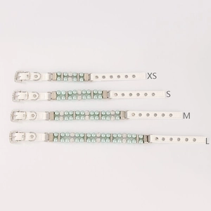 Detail view of light blue pearl pet collar sizes XS to L in white leather material