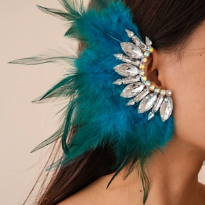 Detailed view of bohemian blue feather ear cuff with sparkling clear crystal rhinestones