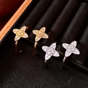 Exquisite C-shape flower earrings with shimmering zircons in gold and silver finish