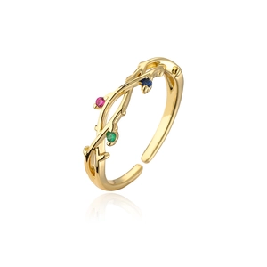 Detail of gold branch ring with multicolored zircon stones and adjustable band