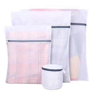 Set of 4 white mesh laundry bags with grey zippers for washing machine protection