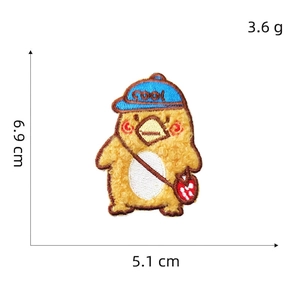Detail of cartoon duck embroidery patch with cool hat and 3D plush texture