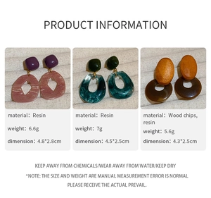 Detail showing geometric resin and wood drop earrings with precise dimensions and weights