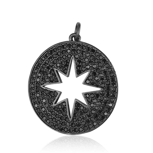 Macro shot of black zircon paved round pendant with hollow star pattern design
