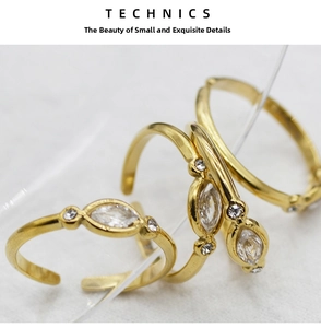 Detailed macro view of adjustable stainless steel rings set with marquise cut zircon