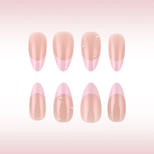 Detailed view of pink French almond press-on nails with elegant pearl embellishments