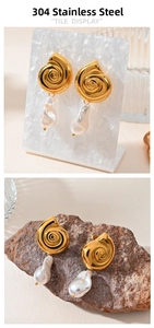 Detail of 18K gold plated seashell earrings with natural baroque freshwater pearls
