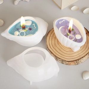 Detailed seashell silicone mold with finished ocean-themed candle featuring pearls