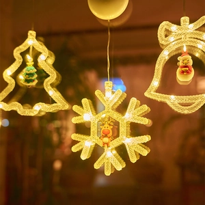 Warm white LED Christmas suction cup lights with festive tree, snowflake and bell designs