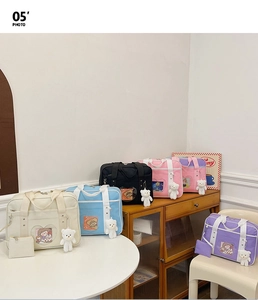 Detail showing various colors of sweet Ita bags with heart-shaped transparent windows