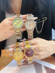 Collection of metal watches featuring a saturn logo dial and engraved bezel detail