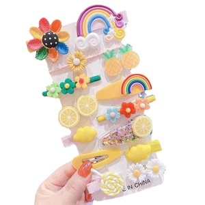 Colorful set of kids' cartoon hair clips with rainbow, flower and fruit designs
