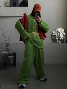 Green casual tracksuit with oversized hoodie and straight-leg pants for a sporty style