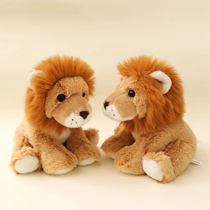 Set of two cute stuffed lion plush toys with fluffy brown manes in sitting posture