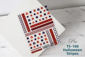 Close-up of Halloween 5D nail stickers with pumpkin and black cat motifs on wood