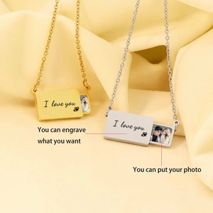 Detail of custom envelope locket pendant showing pull-out photo slot and engraved I Love You