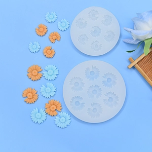 DIY daisy silicone mold set with finished blue and orange resin flower crafts