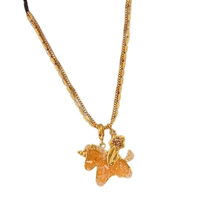 Golden unicorn necklace with orange crystal pendant and small star charm for women
