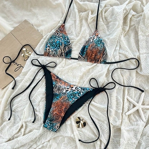 Close-up of mixed leopard and zebra print bikini set with adjustable side ties
