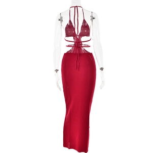 Back view of red knitted two-piece set featuring cutout details and halter tie design