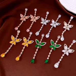Macro detail of elegant butterfly drop earrings with cubic zirconia in four vibrant colors