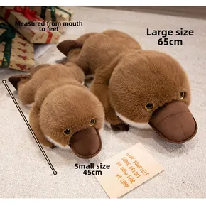 Realistic platypus plush toys in 45cm and 65cm sizes on a cozy carpet for home decor