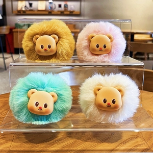Cute plush cream bear keychains in four colors displayed on a modern acrylic shelf
