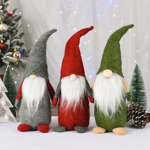 Set of three Christmas gnomes with tall hats and white beards for holiday home decoration