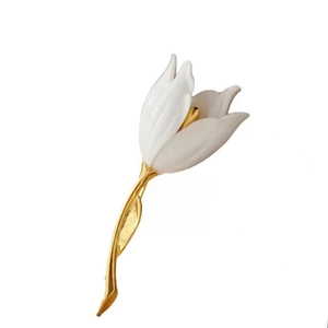 Elegant white enamel rose brooch with golden metal leaves and sparkling rhinestones