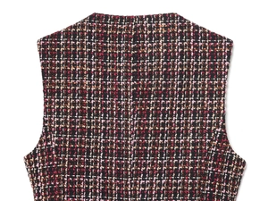 Nahaufnahme der mehrfarbigen Tweed-Stofftextur mit rosa und schwarzen Webdetails