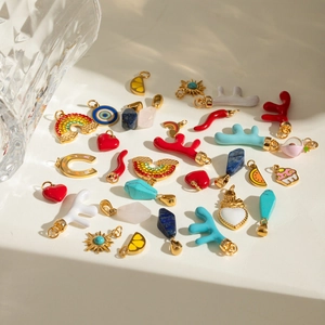 Various enamel and crystal stainless steel pendants in heart, fruit, and sun shapes