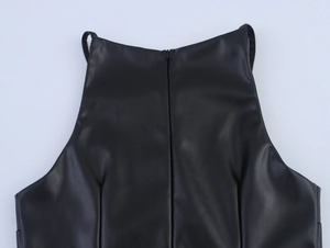 Detailed back view of a black PU leather dress showing the invisible zipper and seam