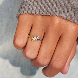 Elegant S925 silver interlocking double heart ring with gold accents and zircon stones