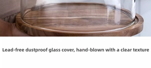 Detail of wooden base and clear lead-free glass dome showing natural wood grain texture